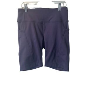 SUGOI purple bike shorts women’s size small with pockets